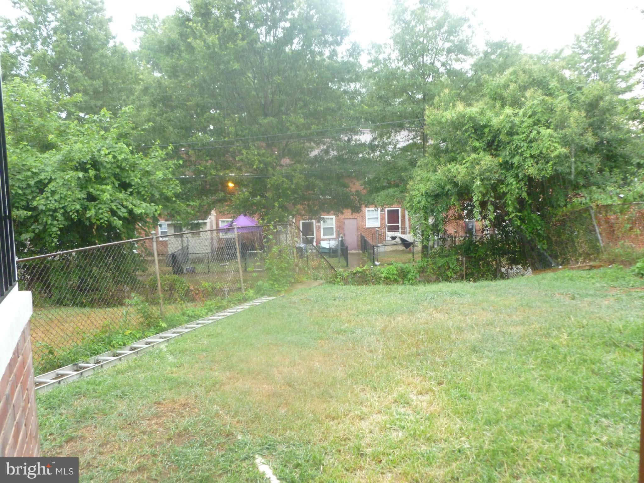 2710 Woodview Road Baltimore, MD 21225 - Photo 3 of 30 Fenced Backyard