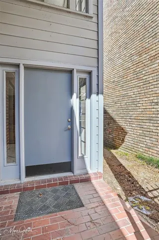 a living room with hard wood flooring and a couch