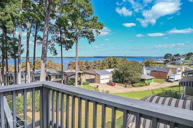 a view of a balcony with two chairs and a table