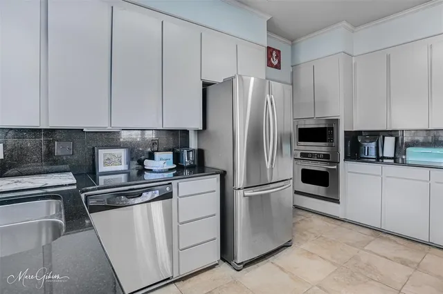 a bathroom with a shower a toilet and sink