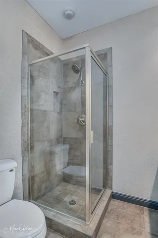 a kitchen with stainless steel appliances a refrigerator sink and cabinets