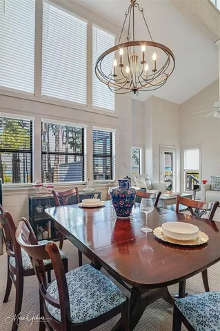 a view of a chairs and table in patio