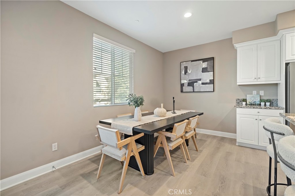 7459 Solstice Place Rancho Cucamonga, CA 91739 - Photo 14 of 57 a view of a dining room with furniture and window