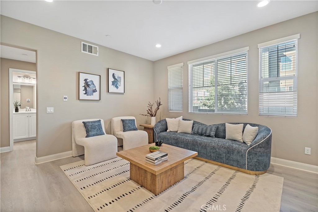 7459 Solstice Place Rancho Cucamonga, CA 91739 - Photo 17 of 57 a living room with furniture and a window