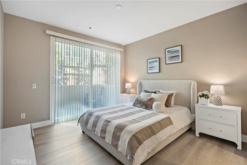 7459 Solstice Place Rancho Cucamonga, CA 91739 - Photo 2 of 57 a bedroom with a large bed and a large window