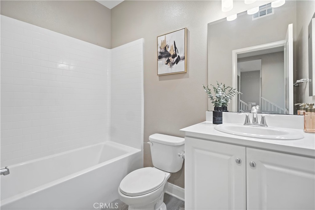7459 Solstice Place Rancho Cucamonga, CA 91739 - Photo 21 of 57 a bathroom with a toilet a sink and a bathtub