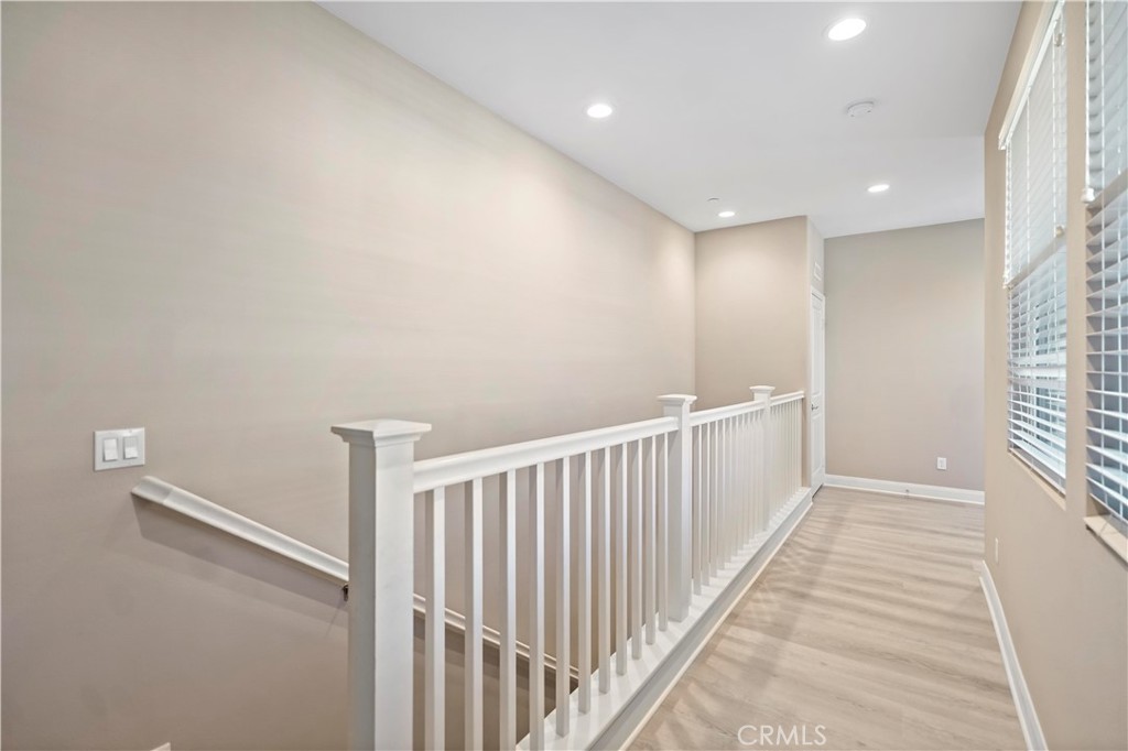 7459 Solstice Place Rancho Cucamonga, CA 91739 - Photo 23 of 57 a view of a hallway with windows