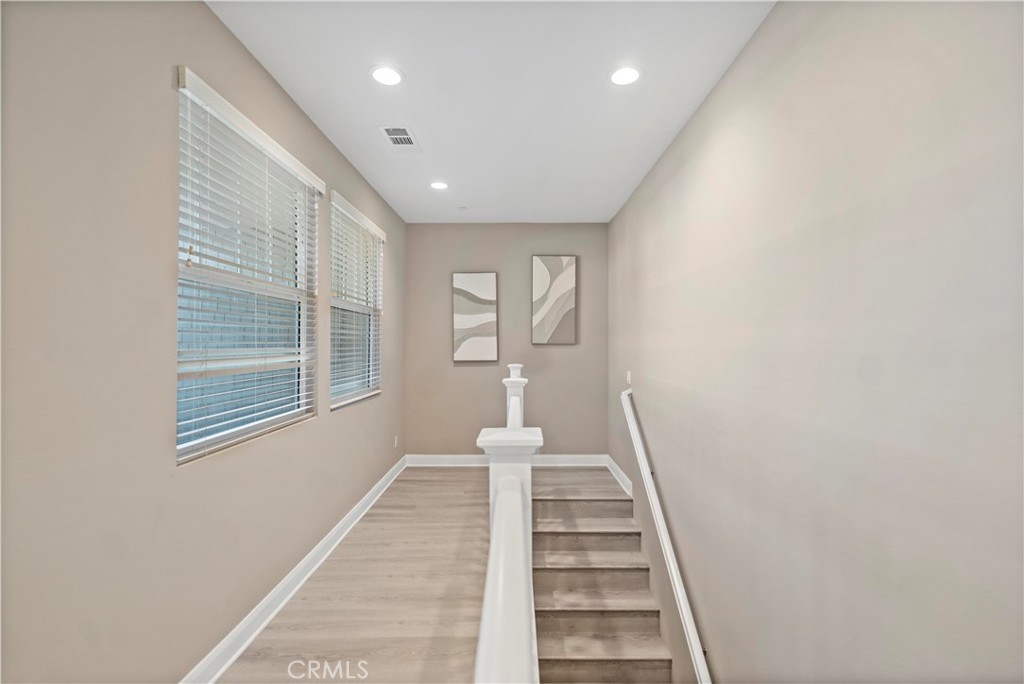 7459 Solstice Place Rancho Cucamonga, CA 91739 - Photo 24 of 57 a view of a hallway with windows