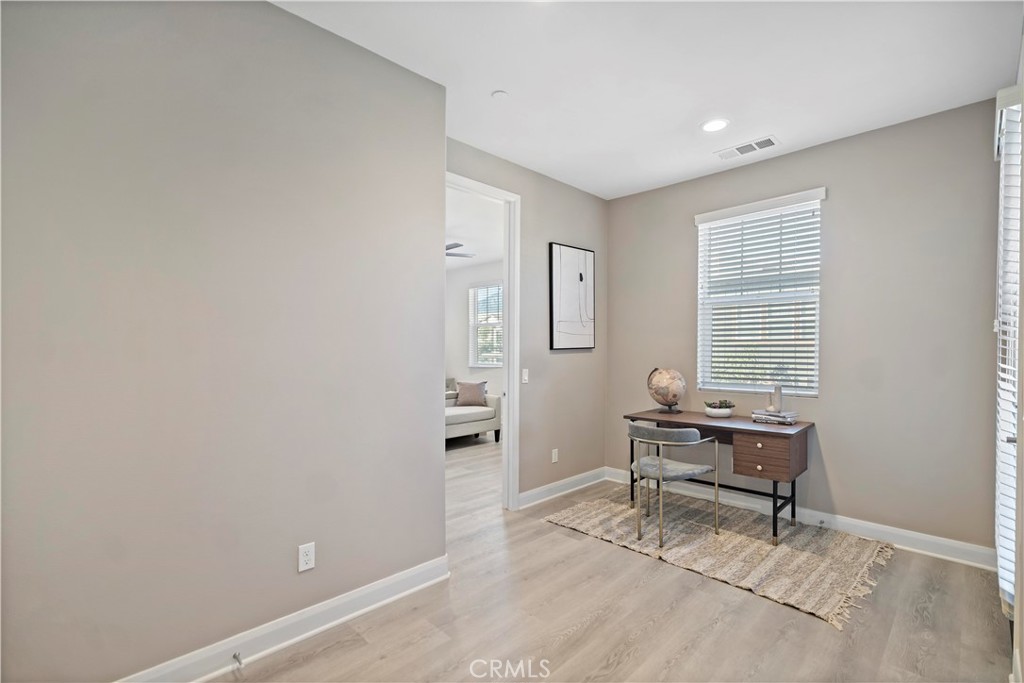 7459 Solstice Place Rancho Cucamonga, CA 91739 - Photo 25 of 57 a view of work space with wooden floor and a window