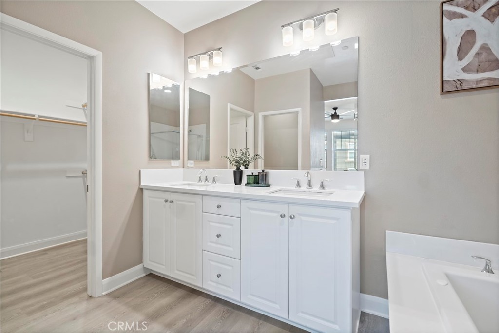 7459 Solstice Place Rancho Cucamonga, CA 91739 - Photo 31 of 57 a bathroom with a double vanity sink and a mirror