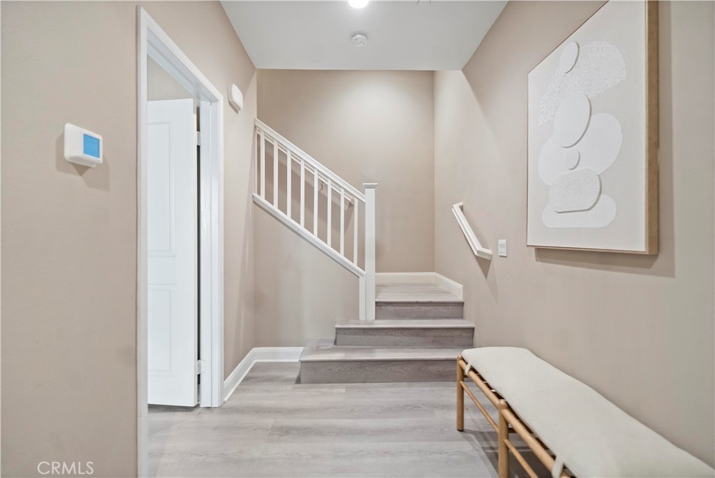 7459 Solstice Place Rancho Cucamonga, CA 91739 - Photo 8 of 57 a view of staircase with white walls and white walls