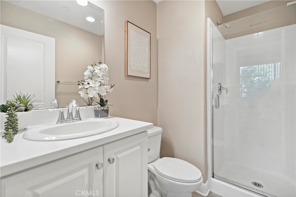 7459 Solstice Place Rancho Cucamonga, CA 91739 - Photo 10 of 57 a bathroom with a sink a toilet and shower