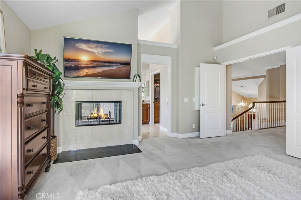 12036 Wood Ranch Road Granada Hills, CA 91344 - Photo 23 of 55 Primary Suite with Double-sided Fireplace