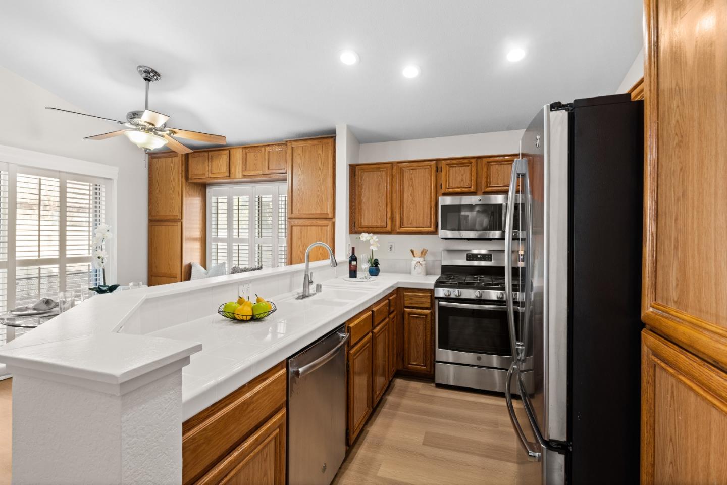 258 Trenton Circle Pleasanton, CA 94566 - Photo 4 of 10 a kitchen with a sink a stove and refrigerator