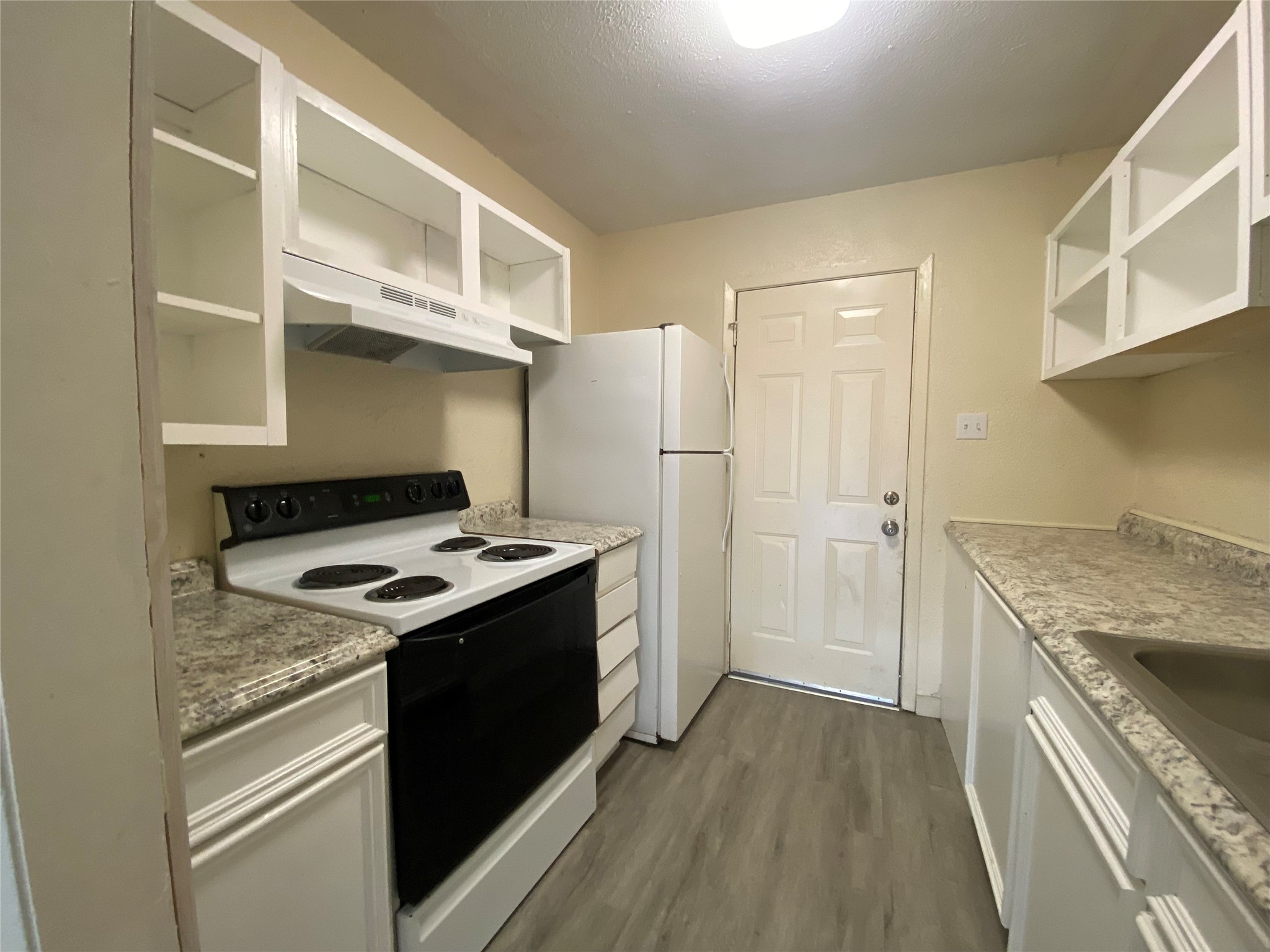 208 Kelly Drive, Unit 7 Trinity, TX 75862 - Photo 12 of 14 Here is the whole kitchen. You can see it has plenty of storage.