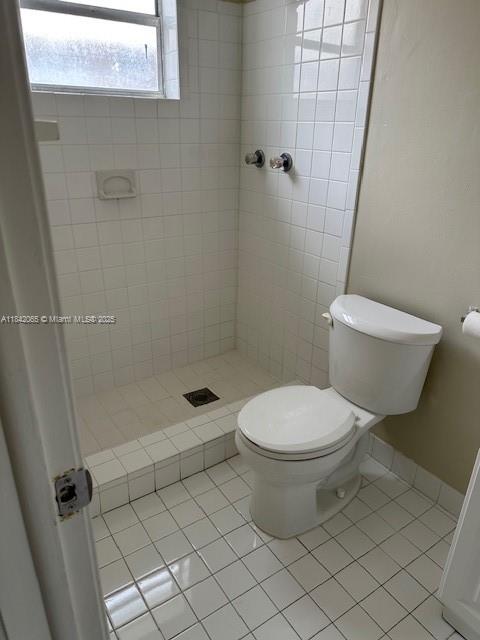 851 Southwest 9th Street, Unit 2 Hallandale Beach, FL 33009 - Photo 7 of 9 a white toilet sitting next to a bath tub