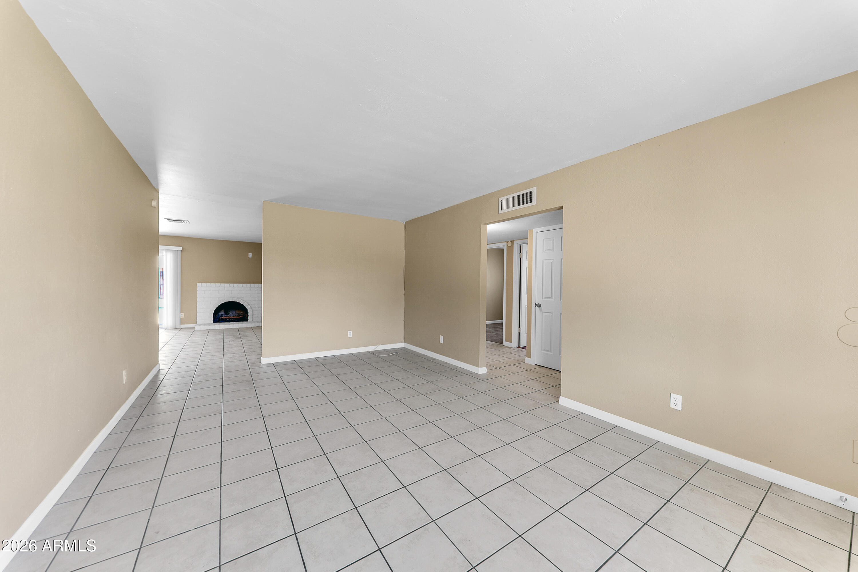 4723 East Vineyard Road Phoenix, AZ 85042 - Photo 5 of 27 a view of an empty room and window