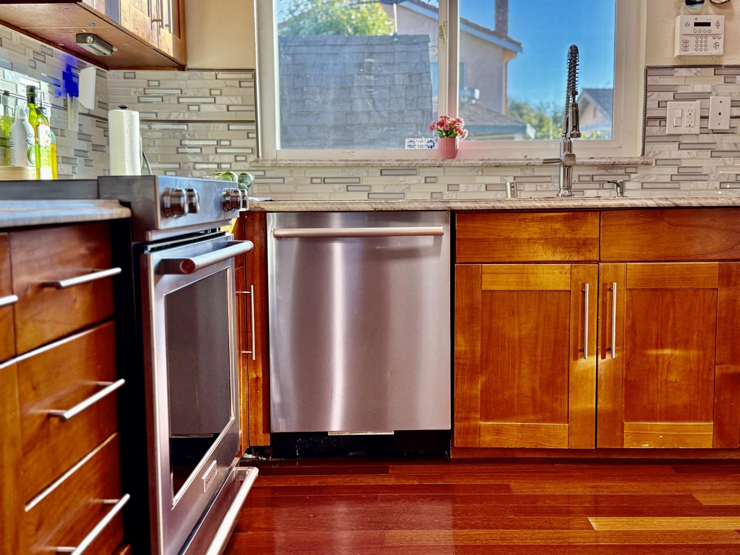 5736 Silver Leaf Road San Jose, CA 95138 - Photo 15 of 42 a kitchen with stainless steel appliances granite countertop a sink and a refrigerator