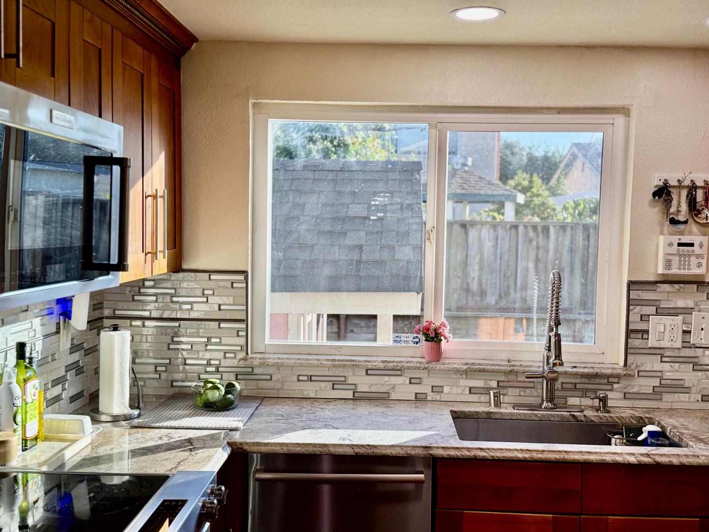 5736 Silver Leaf Road San Jose, CA 95138 - Photo 16 of 42 a kitchen with a sink stove and cabinets