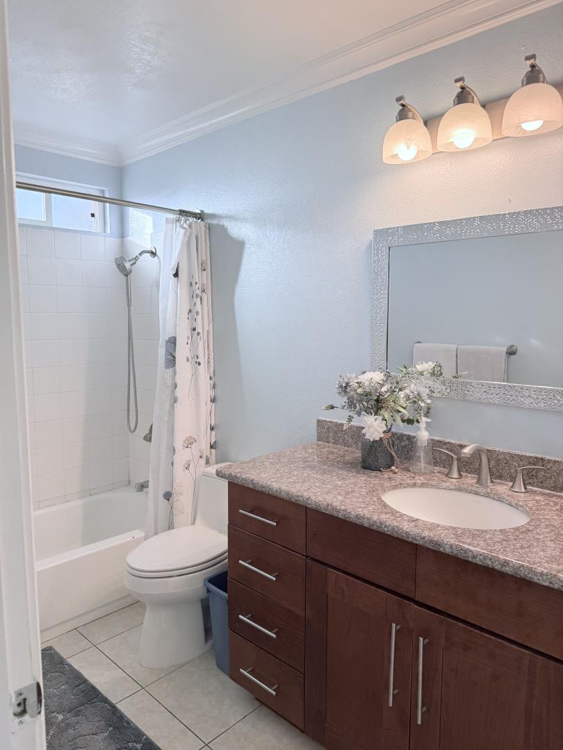 5736 Silver Leaf Road San Jose, CA 95138 - Photo 30 of 42 a bathroom with a granite countertop bathtub sink vanity mirror and toilet