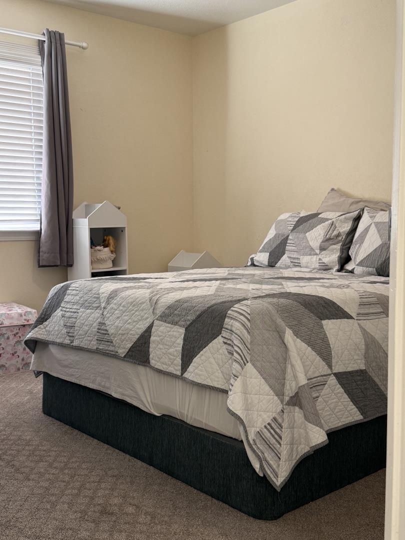 5736 Silver Leaf Road San Jose, CA 95138 - Photo 32 of 42 a bedroom with a bed and window