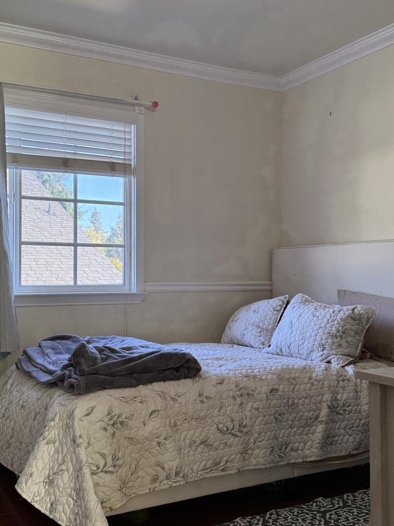 5736 Silver Leaf Road San Jose, CA 95138 - Photo 34 of 42 a bedroom with a bed and a window