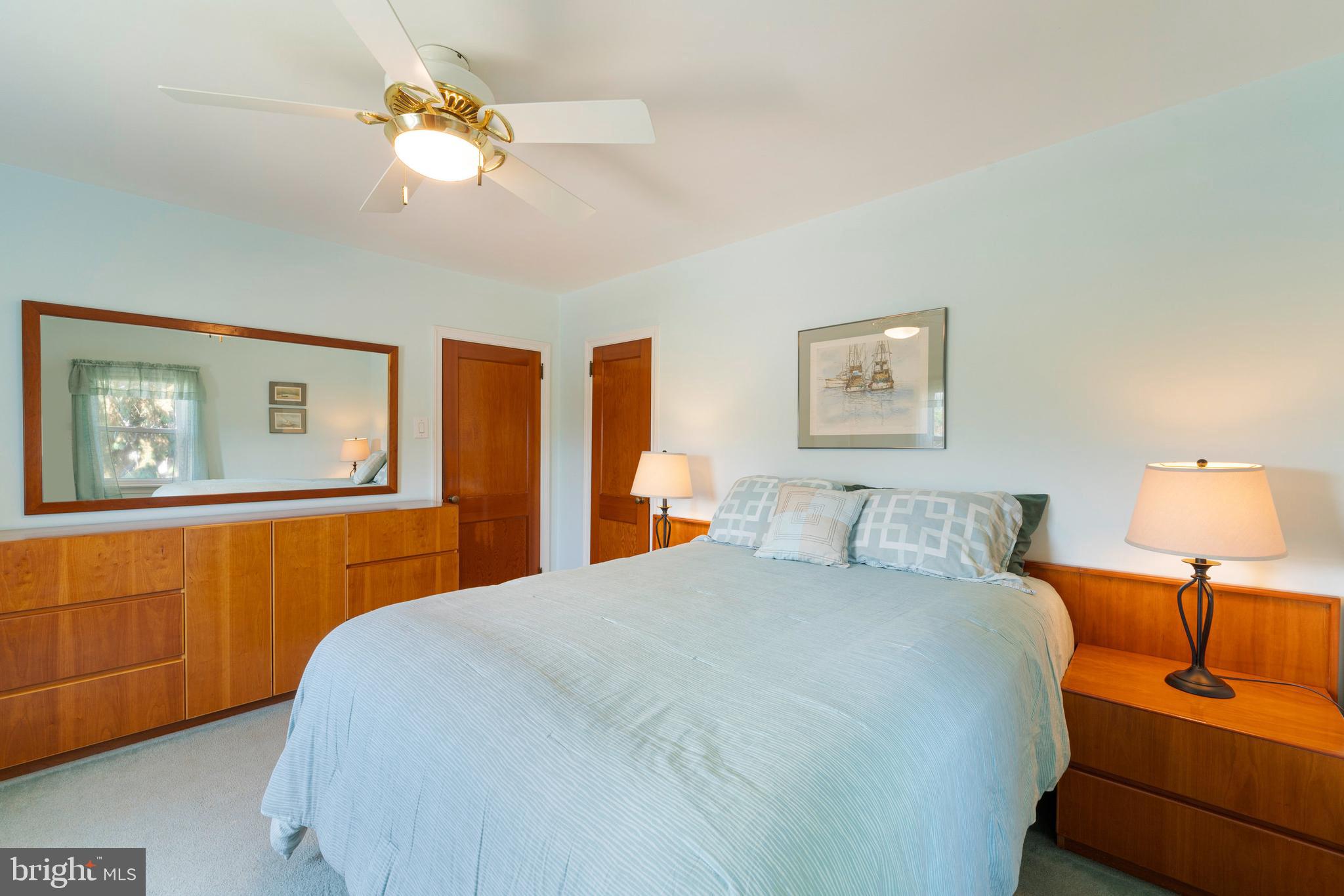 410 Crum Lynne Road Ridley Park, PA 19078 - Photo 22 of 43 a bedroom with a bed chandelier and a window