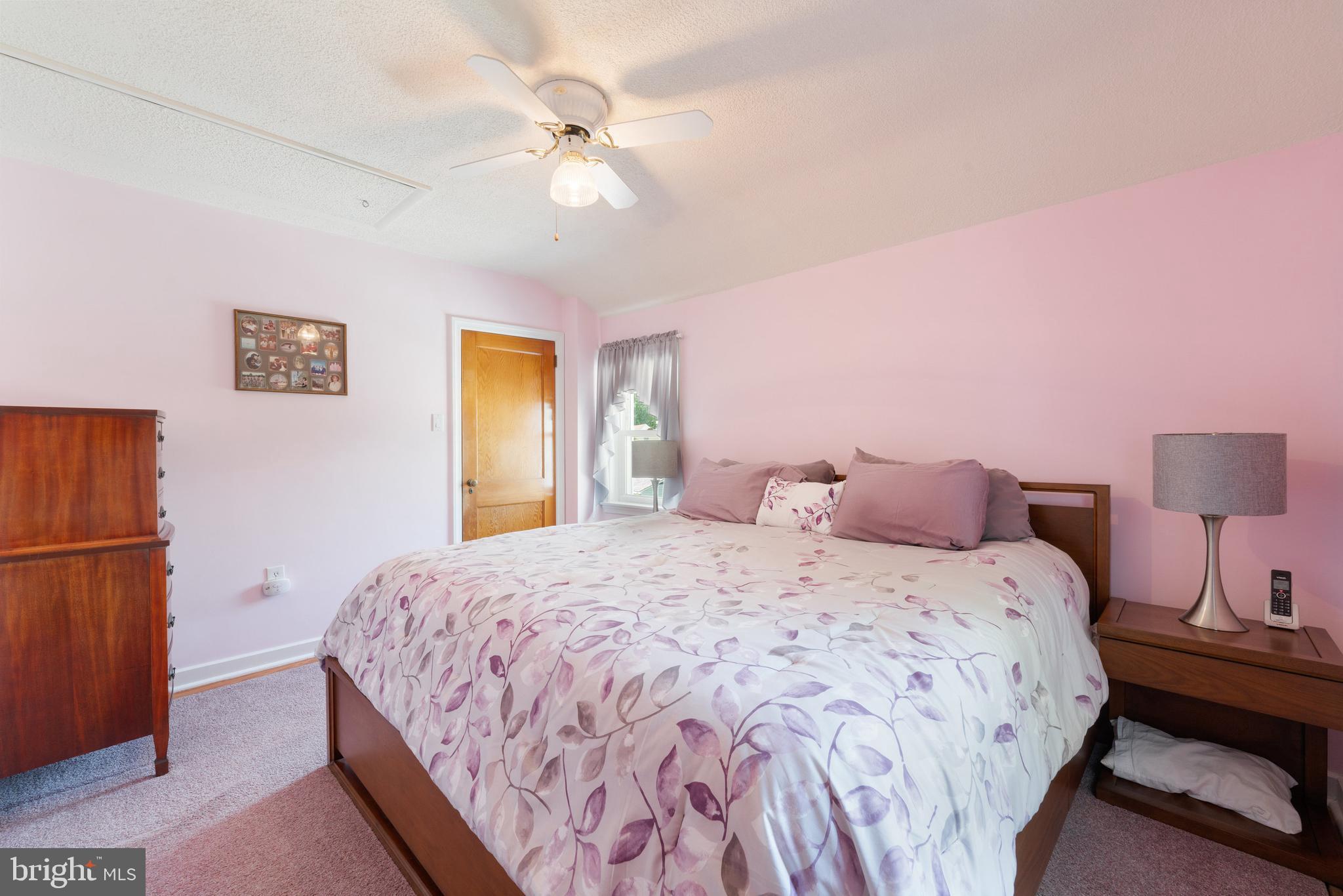 410 Crum Lynne Road Ridley Park, PA 19078 - Photo 23 of 43 a bedroom with a bed and a chandelier