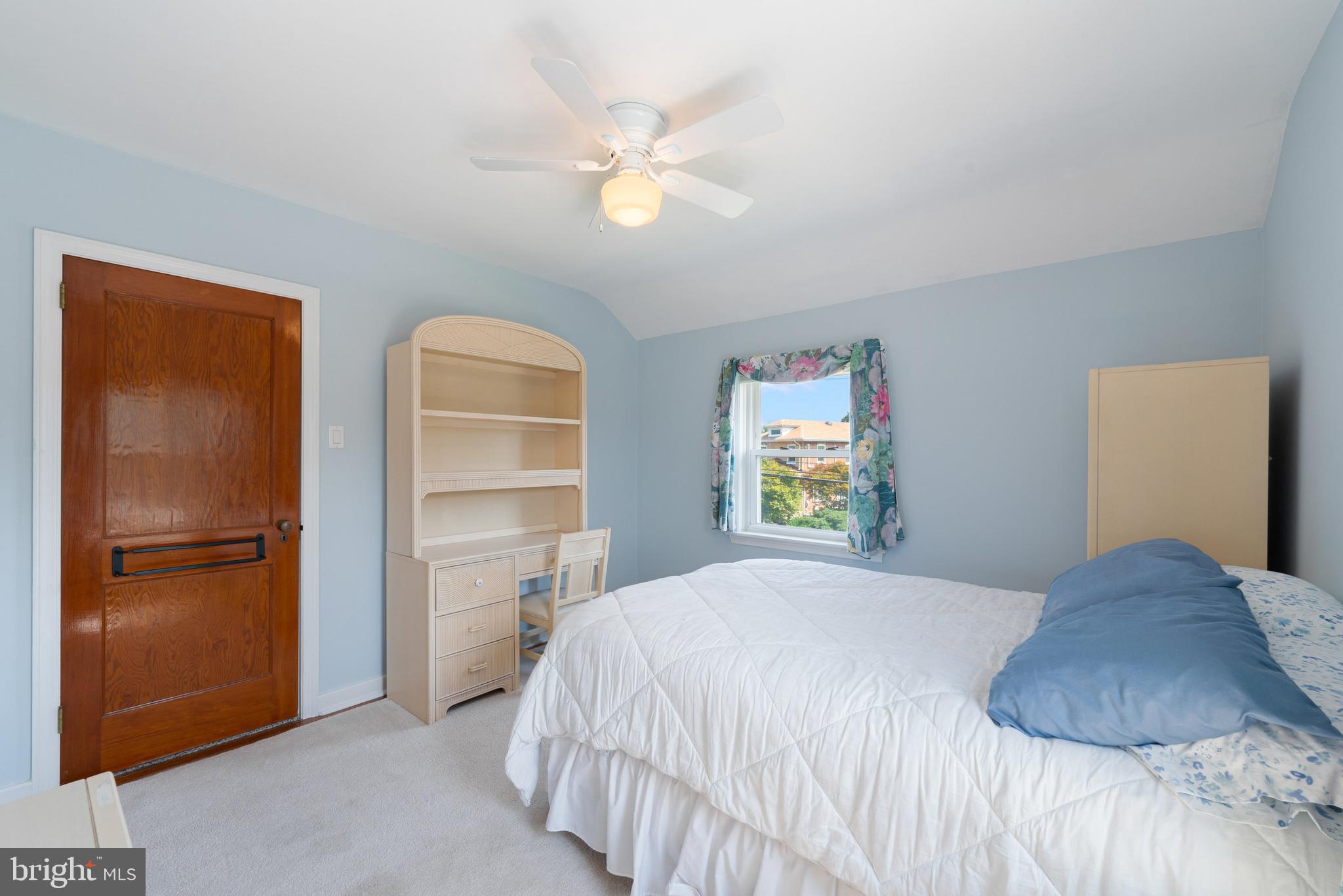 410 Crum Lynne Road Ridley Park, PA 19078 - Photo 25 of 43 a bedroom with a bed and a refrigerator