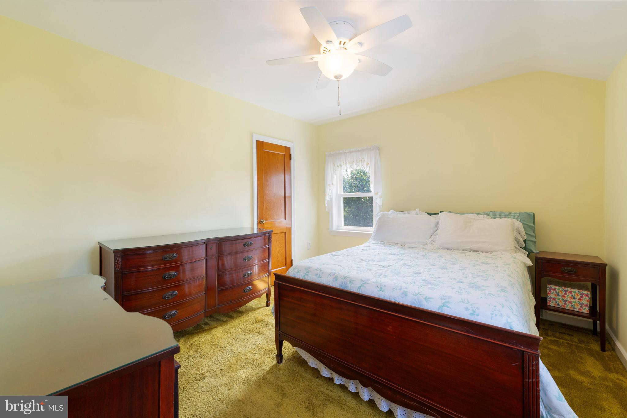 410 Crum Lynne Road Ridley Park, PA 19078 - Photo 26 of 43 a bedroom with a bed and window
