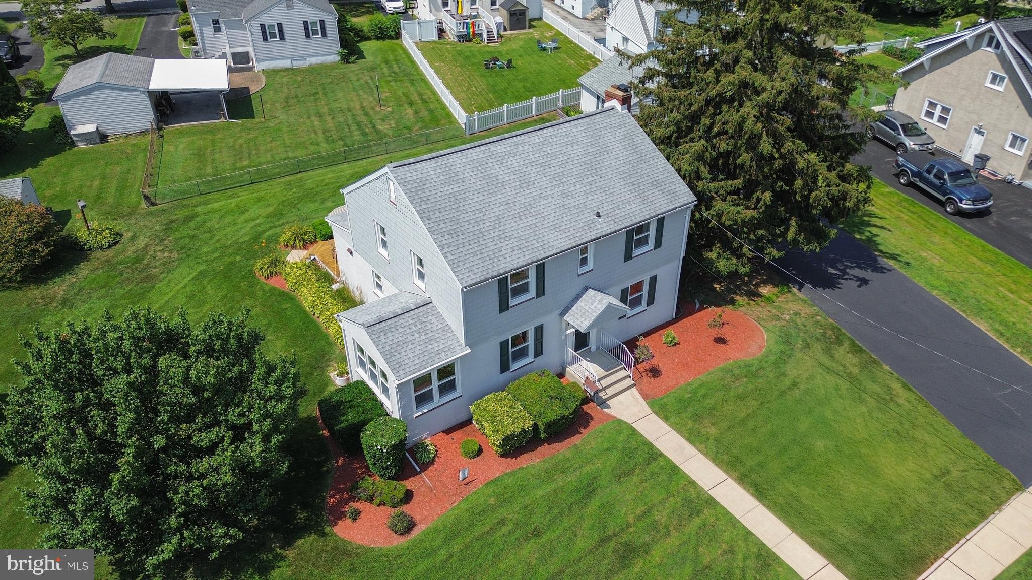 410 Crum Lynne Road Ridley Park, PA 19078 - Photo 36 of 43 an aerial view of a house with a garden and trees