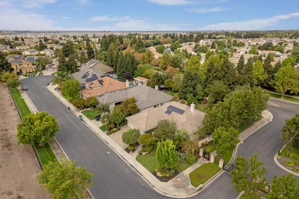 an aerial view of a house with outdoor space