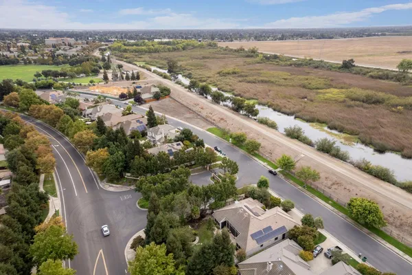 an aerial view of residential houses with outdoor space
