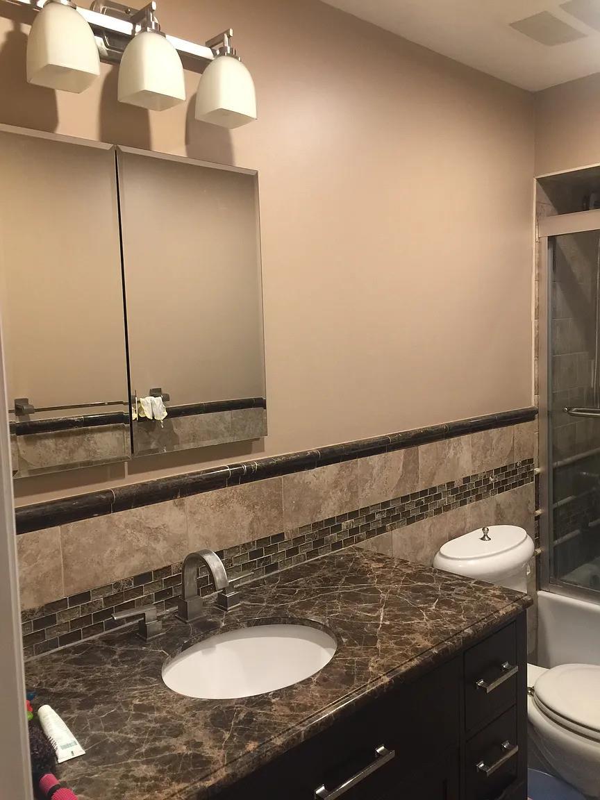 9 Furness Place Staten Island, NY 10314 - Photo 10 of 21 Full bathroom featuring bath / shower combo with glass door, vanity, toilet, and tile walls