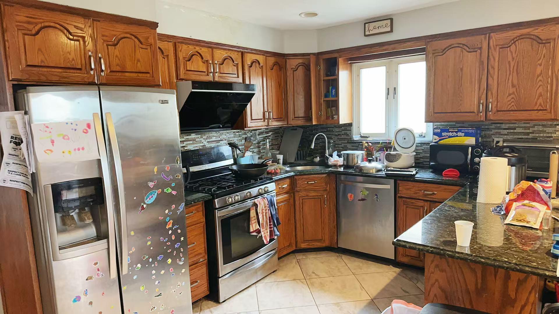 9 Furness Place Staten Island, NY 10314 - Photo 7 of 21 a kitchen with stainless steel appliances granite countertop a stove a sink and a refrigerator