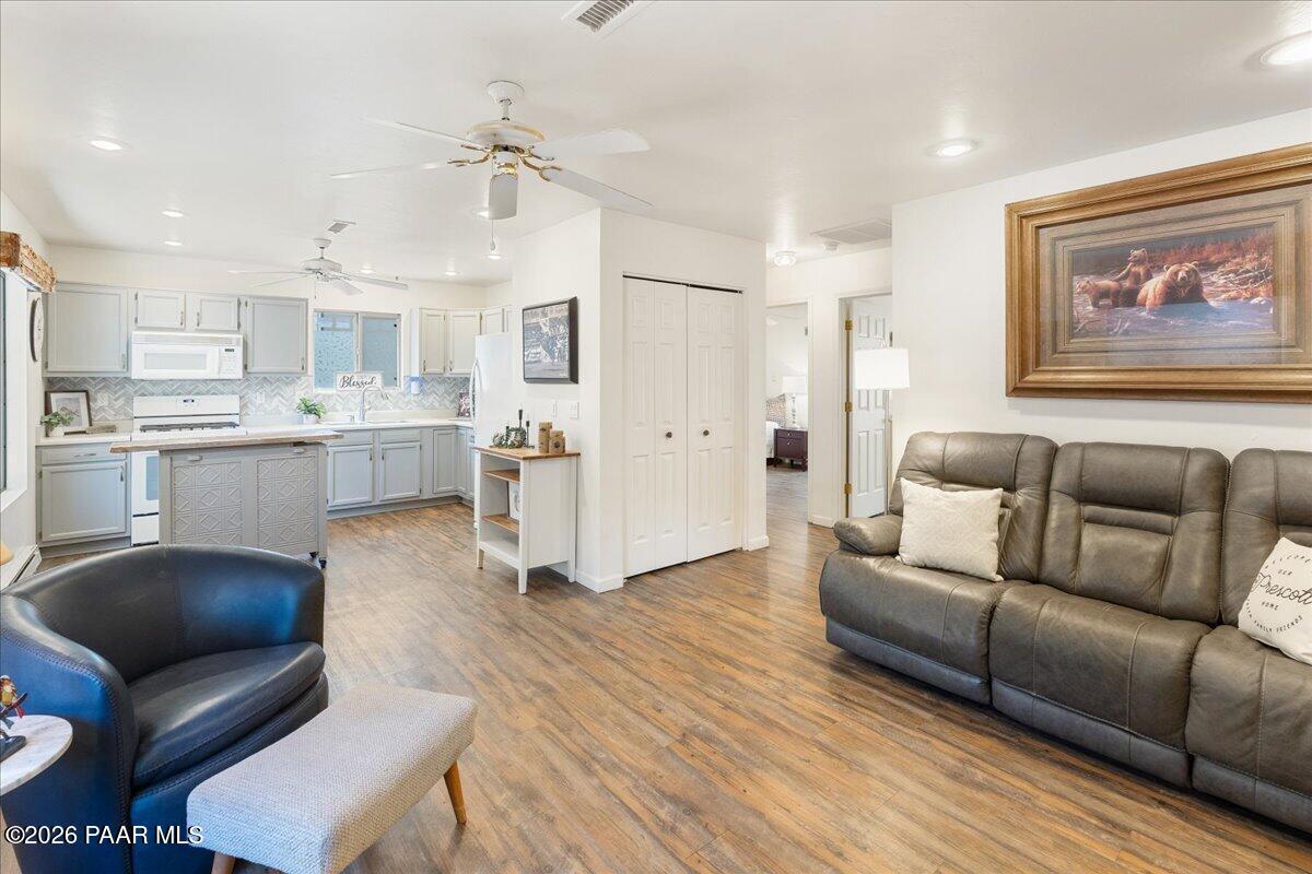 1388 East Pine Ridge Drive Prescott, AZ 86303 - Photo 7 of 16 a living room with stainless steel appliances furniture and a kitchen view