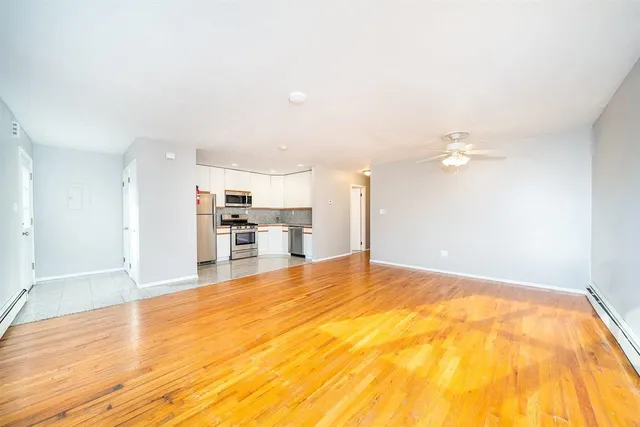 a view of a livingroom with a kitchen