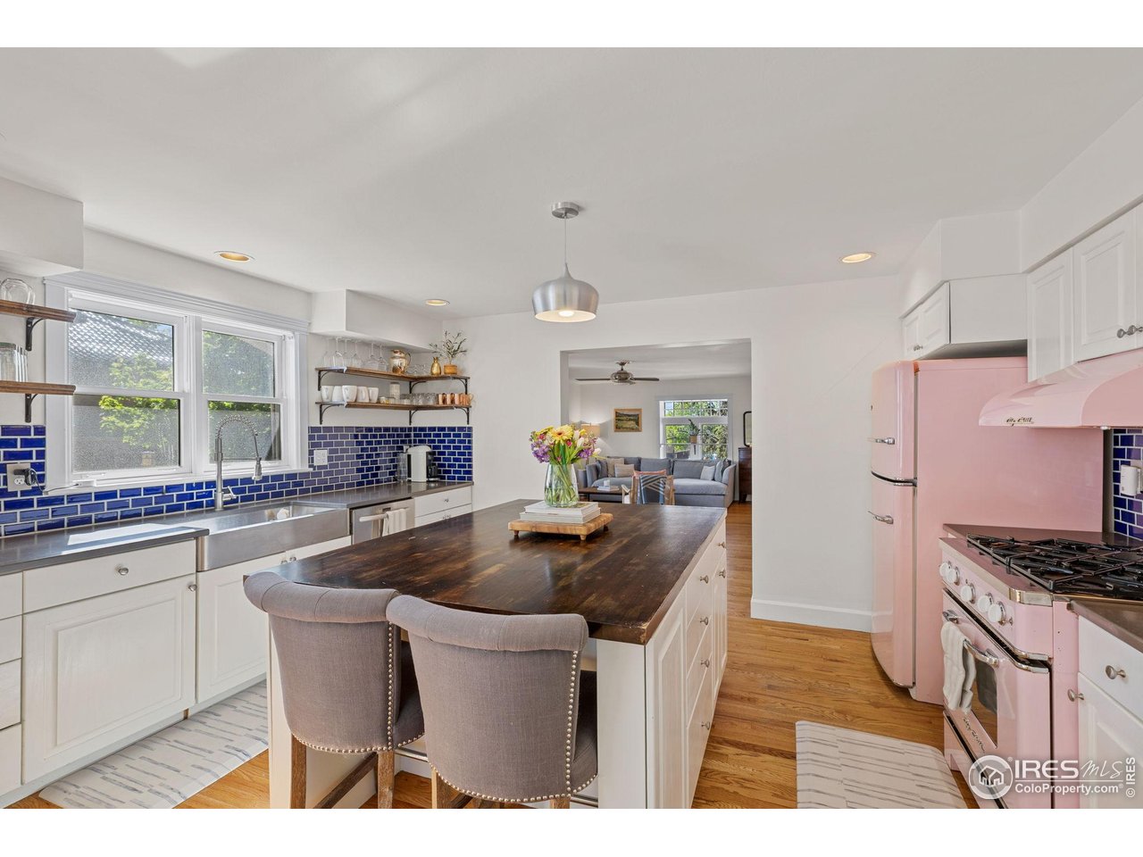1133 Mapleton Avenue Boulder, CO 80304 - Photo 15 of 40 a kitchen with stainless steel appliances granite countertop a sink stove and refrigerator