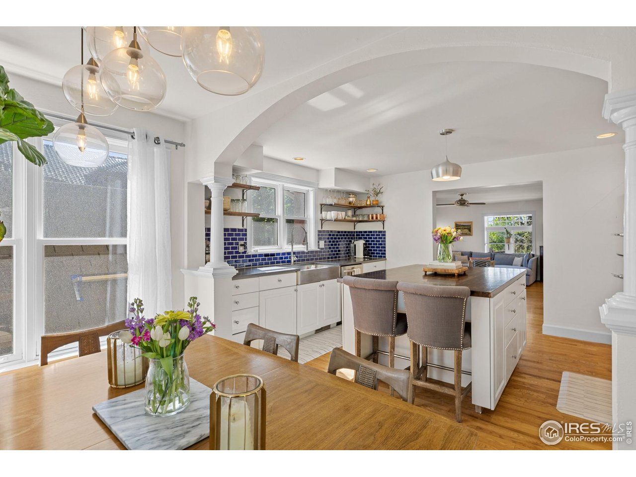 1133 Mapleton Avenue Boulder, CO 80304 - Photo 17 of 40 a living room with furniture and a dining table with kitchen view