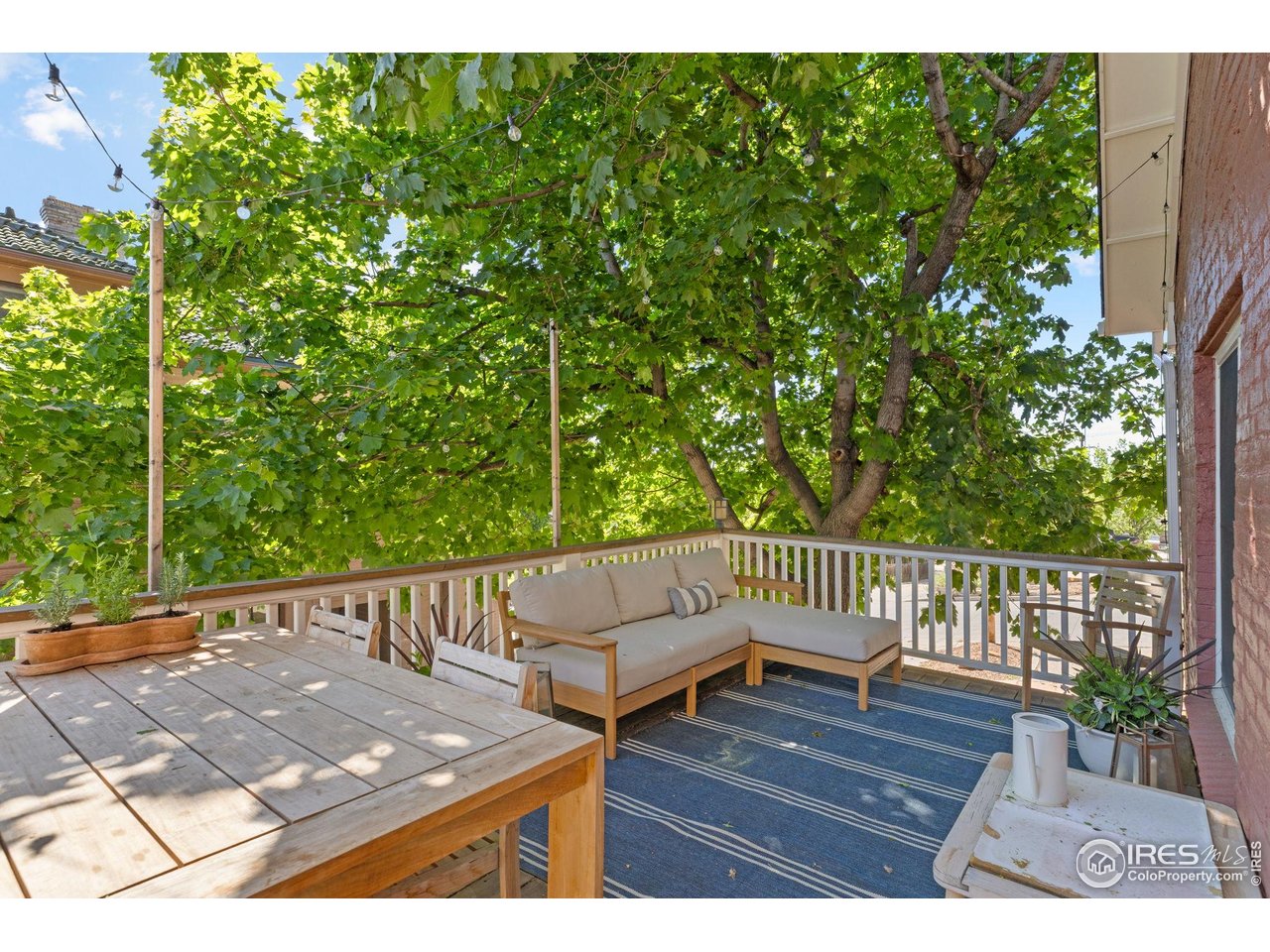 1133 Mapleton Avenue Boulder, CO 80304 - Photo 21 of 40 a view of a wooden deck with a bench