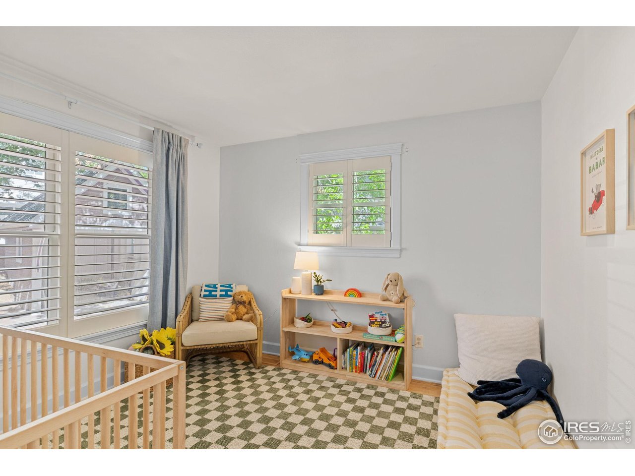 1133 Mapleton Avenue Boulder, CO 80304 - Photo 22 of 40 a bedroom with furniture and a window