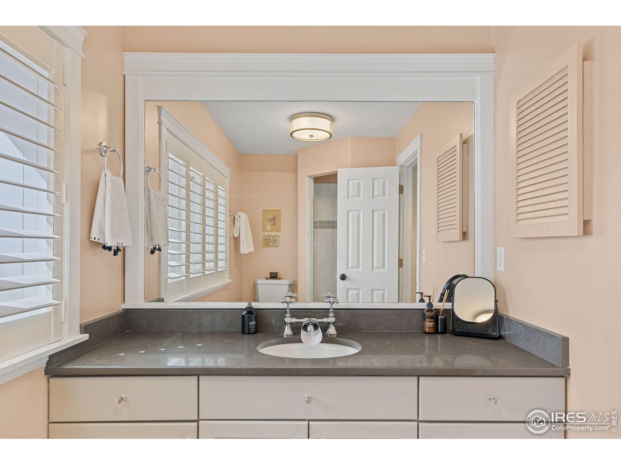 1133 Mapleton Avenue Boulder, CO 80304 - Photo 23 of 40 a bathroom with sinks granite and a mirror