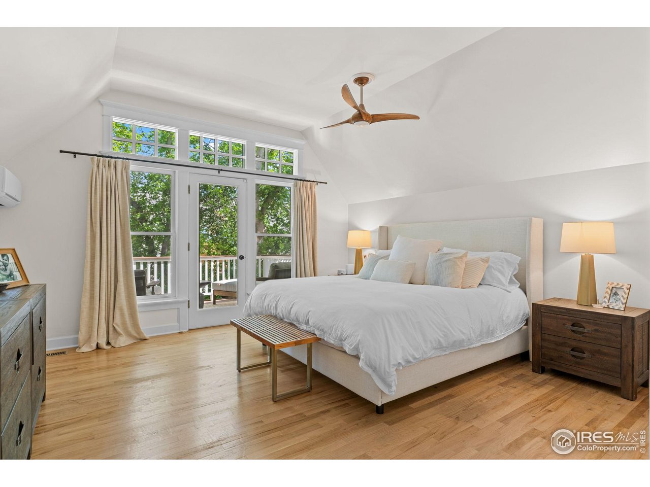 1133 Mapleton Avenue Boulder, CO 80304 - Photo 24 of 40 a living room with a bed furniture and a large window