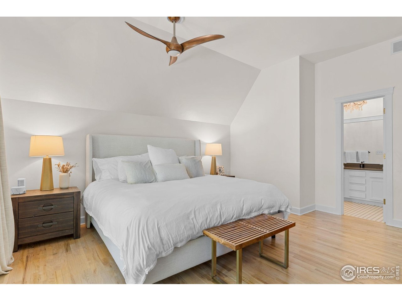 1133 Mapleton Avenue Boulder, CO 80304 - Photo 25 of 40 a bedroom with a bed a dresser and a night stand