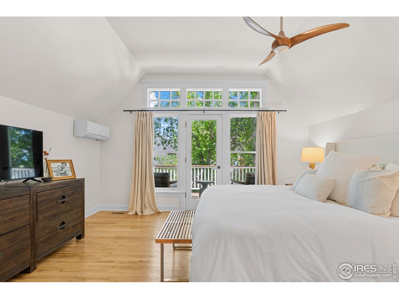 1133 Mapleton Avenue Boulder, CO 80304 - Photo 26 of 40 a bedroom with a large bed and a window