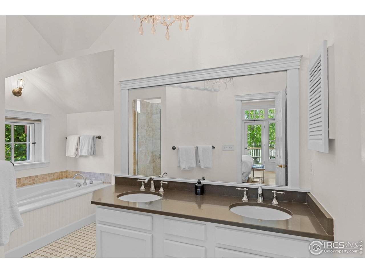 1133 Mapleton Avenue Boulder, CO 80304 - Photo 29 of 40 a bathroom with a granite countertop sink mirror and a