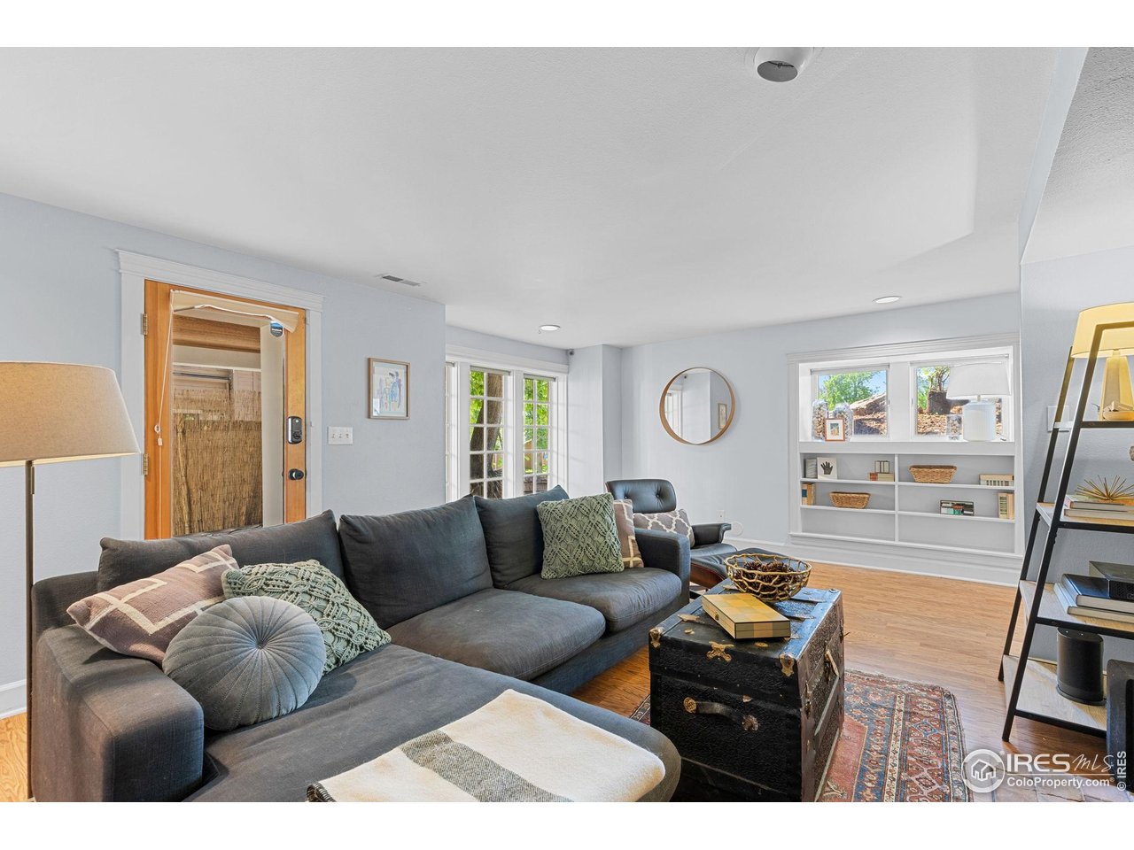 1133 Mapleton Avenue Boulder, CO 80304 - Photo 34 of 40 a living room with furniture and a flat screen tv