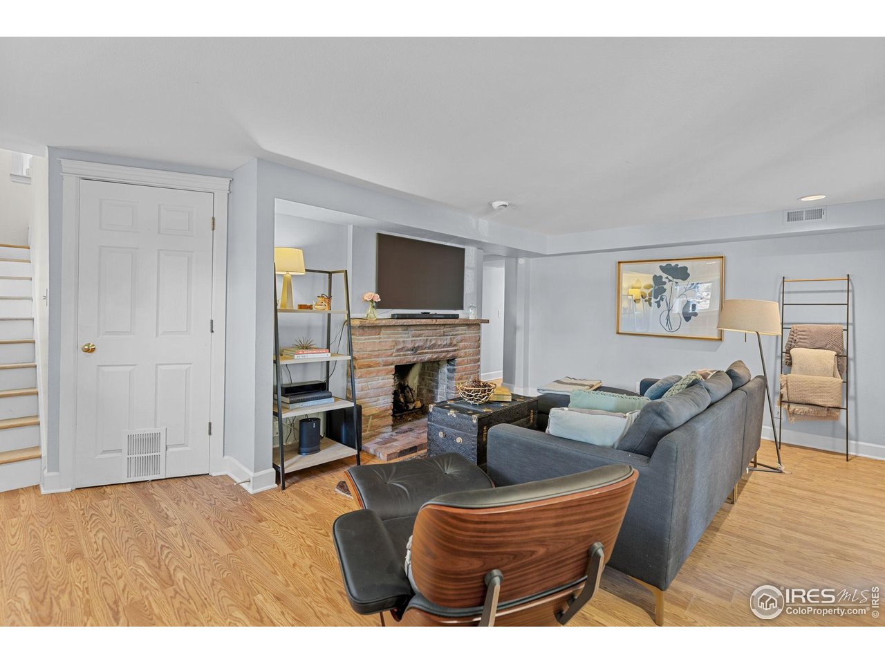 1133 Mapleton Avenue Boulder, CO 80304 - Photo 35 of 40 a living room with fireplace furniture and a flat screen tv