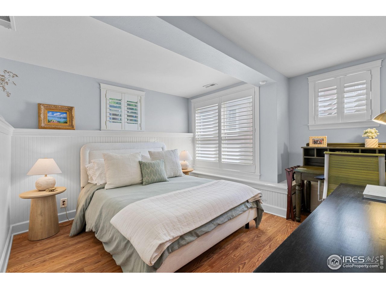 1133 Mapleton Avenue Boulder, CO 80304 - Photo 36 of 40 a bedroom with a bed and wooden floor