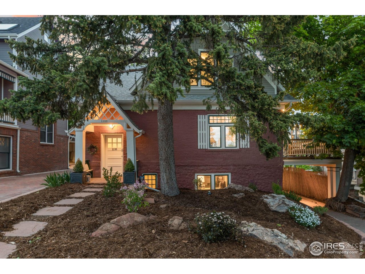 1133 Mapleton Avenue Boulder, CO 80304 - Photo 4 of 40 a front view of a house with a yard